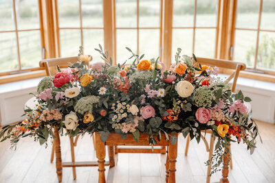 Stunning wedding ceremony flower arch and aisle decorations at Hyde House